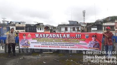 Polsek Sidikalang Kota Lakukan Pemasangan Spanduk Himbauan Kamtibmas di Pusat Pasar